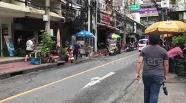Three injured after crane falls onto the road in the Bangkok