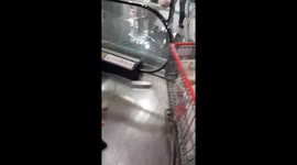 Bemused shoppers walk by 'river' inside flooded mall after roof collapsed