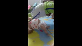 Baby copies her brother's 'yoga' poses