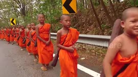 Young Buddhist monks on walking trip