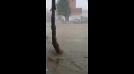 People stuck in cars in main road during flood