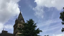 surveillance drone hovering in blue sky