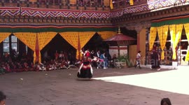 buddhist monks dancing at Paro Tshechu festival