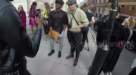 Brooklyn Beckham poses with fans outside London Fashion Week