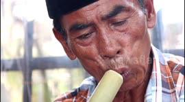Watch an Indonesian craftsman build a traditional minangkabau flute from scratch