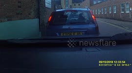 2 People on a Mobility Scooter almost plough into a car !!