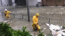 Residents tread through flooded streets as Typhoon Mangkhut brings torrential rains to Hong Kong