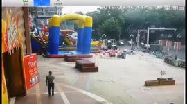 Three injured as powerful winds blow bouncy castle away