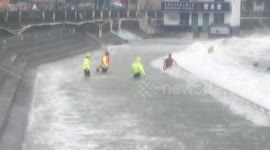 Drunk man attempts to swim in powerful waves