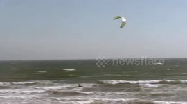 Kite surfers enjoy high winds during Storm Helene