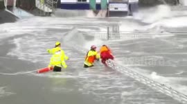 Drunk man attempts to swim in powerful waves