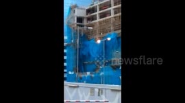 Scaffolding on building falls apart after Typhoon Mangkhut hits Hong Kong