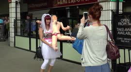 Young women having pre-wedding fun with a doll