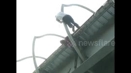 Moment heroic traffic cop saves 'suicidal' man from bridge in India