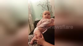 Adorable baby has priceless reaction when startled by a pig grunting sound