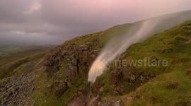 Newsflare Edit - Waterfall inverted by strong winds of storm Helene