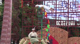 Kung fu master shows off calligraphy skills on top of knife ladder