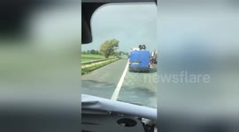 Moment HGV topples over in high winds on UK motorway