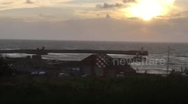 The end of Storm Ali. Waves crashing over the harbour walls at Whitehaven, Cumbria