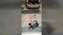 Slapstick scene as man slips up and smashes watermelon
