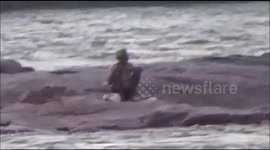 Locals rescue man stuck in Indian flooded river