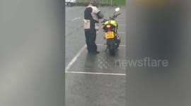 Hilarious footage shows biker struggling to mount bike