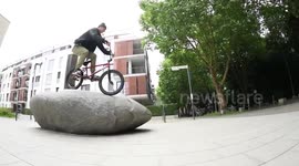 Cool BMX Bike Rider goes over Huge Rock