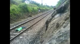 Man risks his life lying on railway tracks as train speeds over him