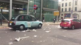 The tail end of Storm Ali whips up leaves and litter in London
