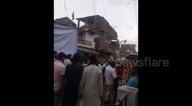 Seventeen injured when balcony collapses above procession in India
