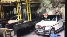 Moment SUV gets showered in thousands of glass pieces in toll booth accident