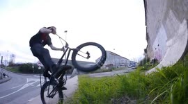Extreme: BMX Bike Rider jumps a Gap to Wall / Almost hitting Car and Bike Rider
