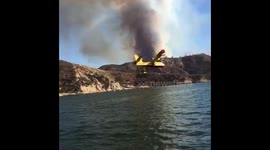 Fire crews employ Super Scooper aircrafts to fight growing Charlie Fire