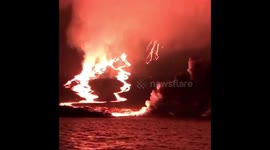 Lightning streaks through night skies as Galapagos volcano erupts