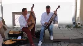 Two street buskers play Bandura