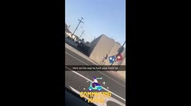 Man on unicycle leaving dominos