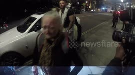 Elderly woman heckles photographers outside National TV Awards