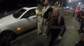 Newsflare Edit - Elderly woman heckles photographers outside National TV Awards