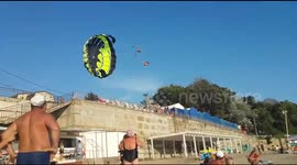 Horror as Russian couple crash into electric cables while paragliding
