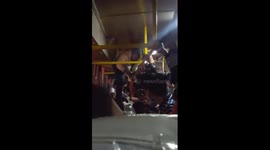 Bus conductor dubbed 'Spiderman' after dangling from roof to collect fares