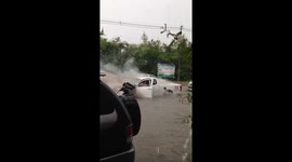 Car engine overheats with smoke after being trapped in Thailand flood
