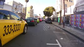Child handcuffed and victim recognizes him. SFPD, Mission District. La Mision. San Francisco. California.Bycicle cam.