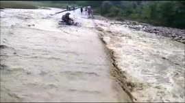 Video shows rushing floodwaters washing away locals' motorcycle in north India