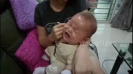 Baby refused his mom cleaning his ear