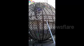 Father and son motorcyclists ride 'globe of death' at high speed