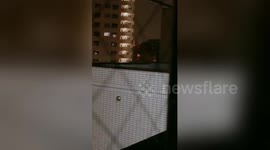 Footage shows lights in apartment windows flickering non-stop as typhoon bears down on Tokyo