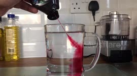 Slow motion squash shot into water