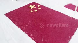 Chinese farmers create giant national flag with carpet of chilli peppers