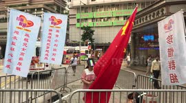 A pro-Beijing demonstrator stands along in the Hong Kong National Day protest