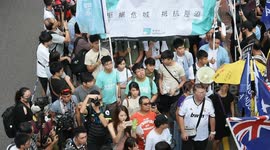 Demosistō supporters stand beside the Hong Kong Independence group, each calls for self-determination during the National march in Hong Kong